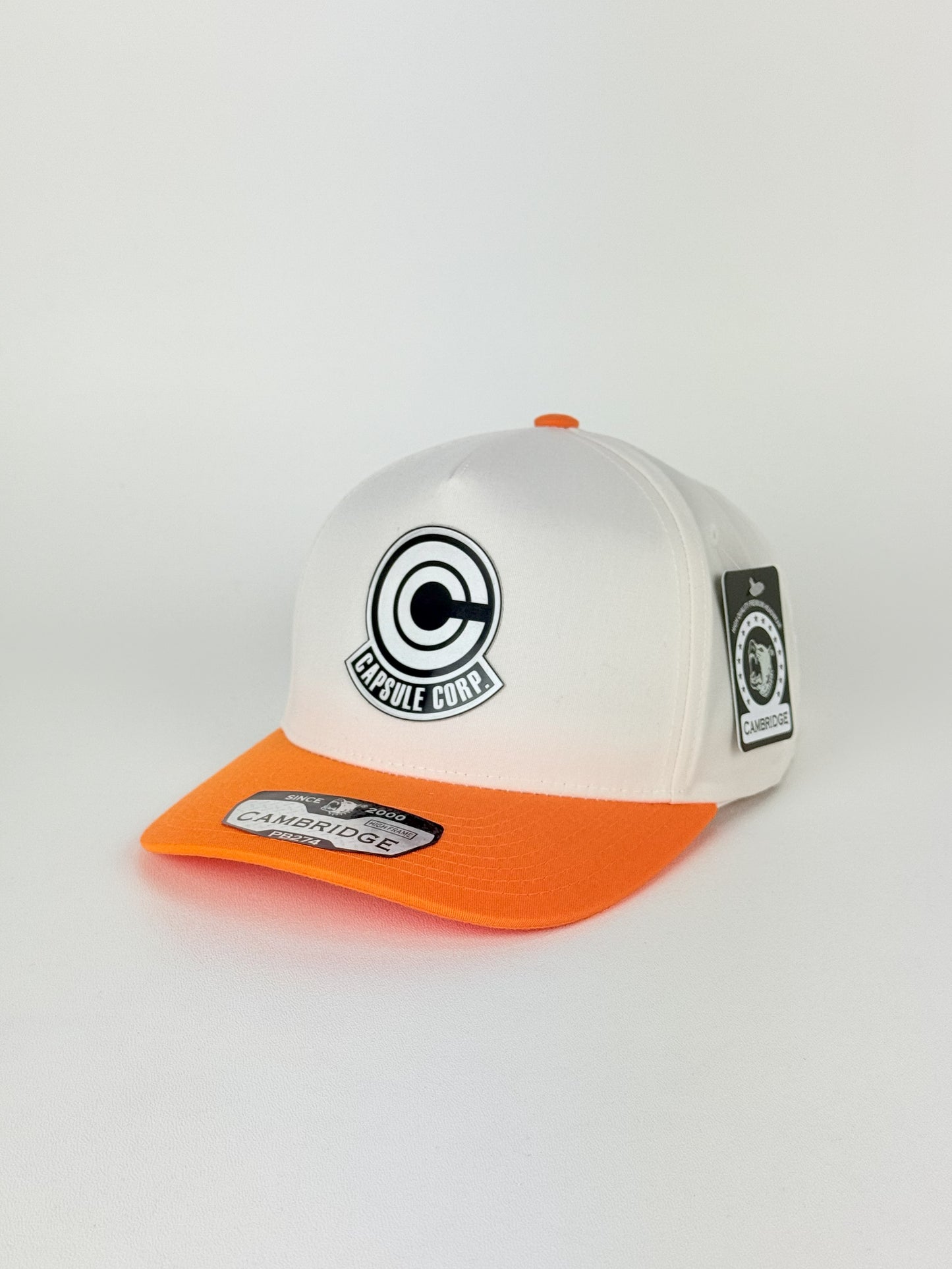 Capsule Corp Trucker Hat – PB274 High Frame (Cream/Orange)