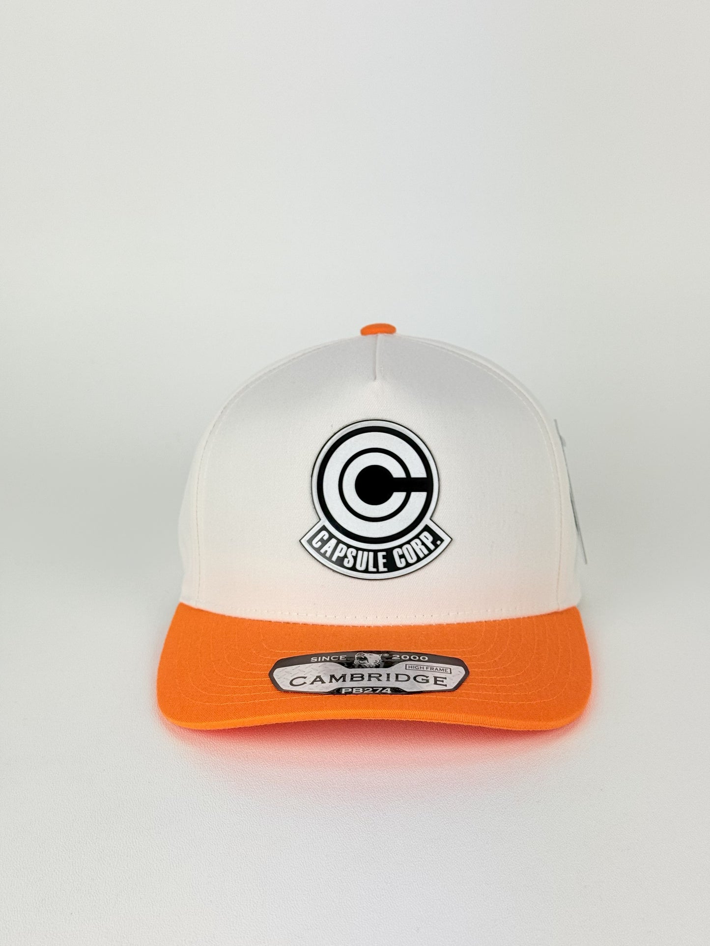 Capsule Corp Trucker Hat – PB274 High Frame (Cream/Orange)
